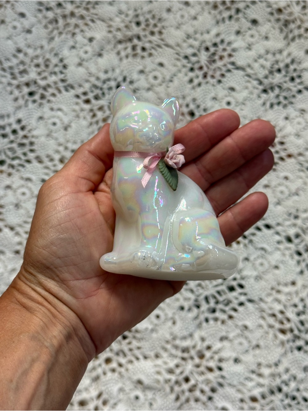 Vintage Iridescent White Cat Figurine with Pink Bow and Green Leaf Accent